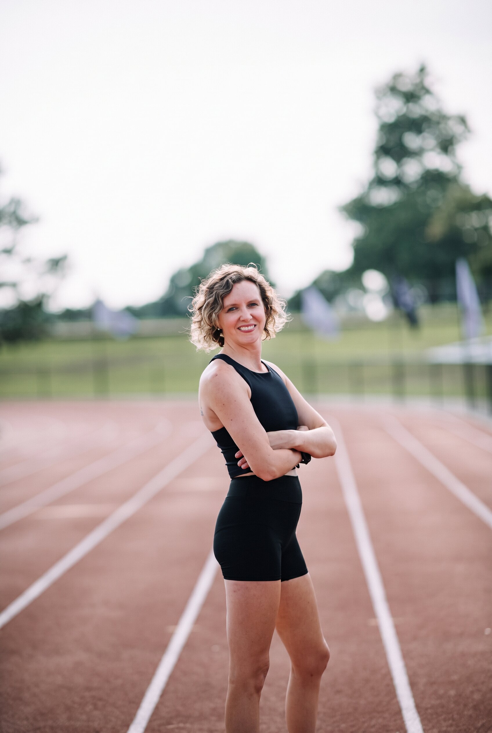 Coach Theresa on a running track in St. Louis